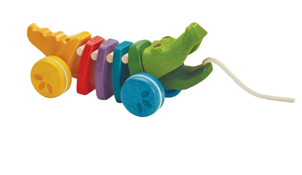 Plan Toys - Nachziehtier - Regenbogen Krokodil, Gummibaumholz